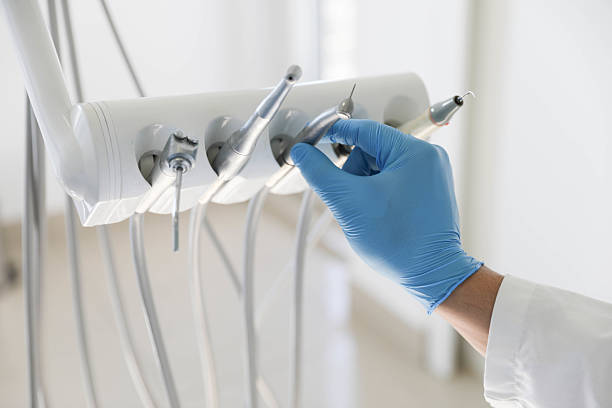Professional Tooth Extraction technician working in Kent County County, MI